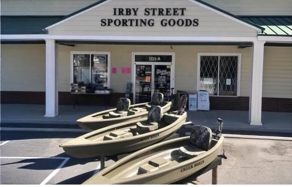 Creek Boats in front of Irby Street Sporting Goods