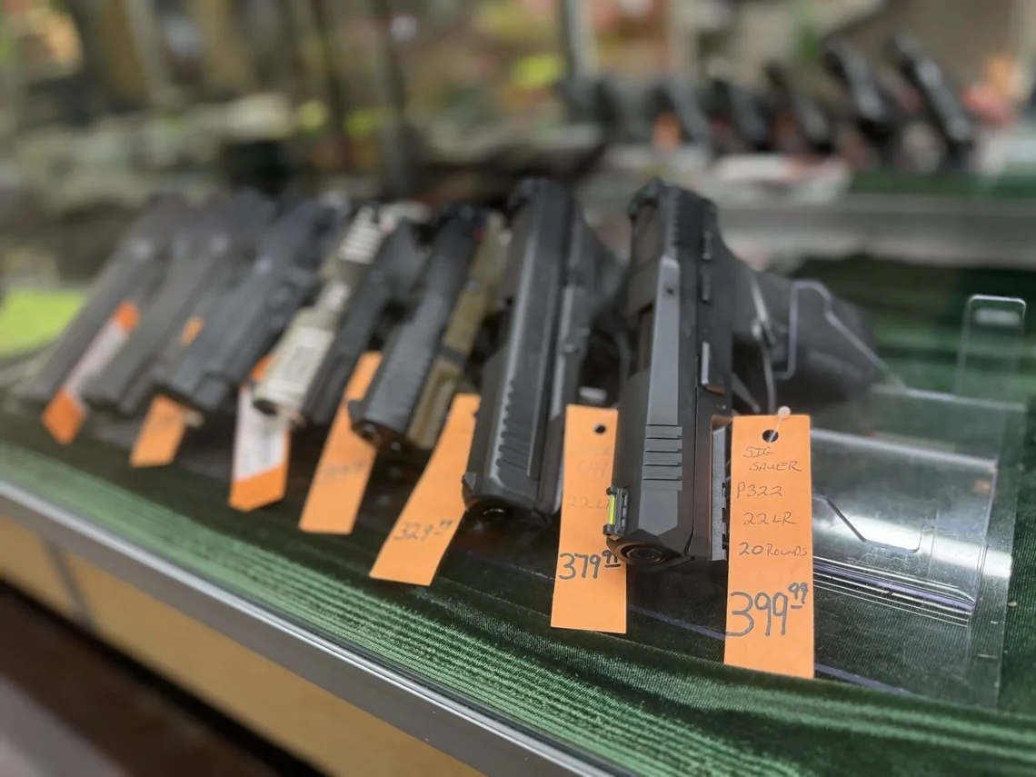 Handguns for sale in display case at Irby Street Sporting Goods, Florence SC